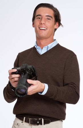 
Laughing man in brown holding a photo camera 
の写真素材