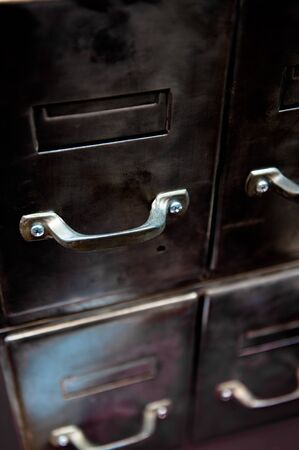 Close up shot on an old metallic file drawerの写真素材