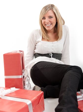 

Laughing blonde young woman on the floor with presents
の写真素材