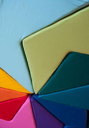 Close up shot on a colorful cushion arrangementの写真素材