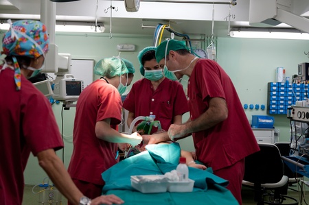 Medical team performing a pediatric surgeryのeditorial素材