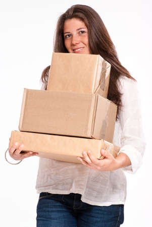
Young woman in casual clothes carrying a pile of parcels
の写真素材