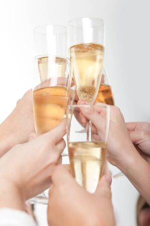 
Seven hands raising champagne flutes on a toast
の写真素材
