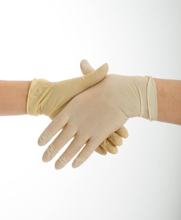 
Handshake with hands wearing latex protective gloves
の写真素材