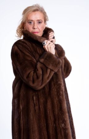 Senior lady wearing a mink coatの写真素材