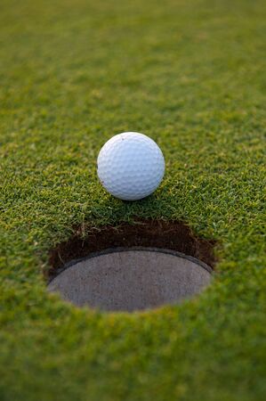 Golf ball and holeの写真素材