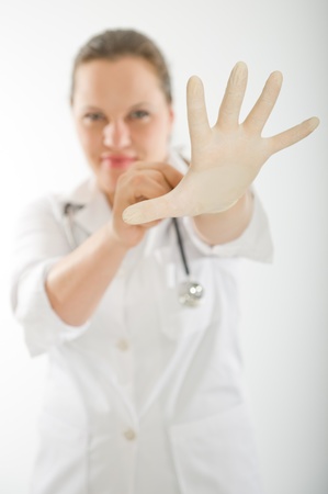 
Scary image of a female doctor putting on a latex glove
の写真素材