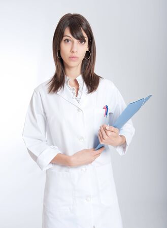 
Standing young medical worker holding a folder
の写真素材