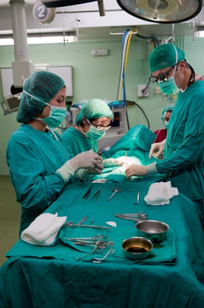 Medical team performing surgery on a young patientの写真素材