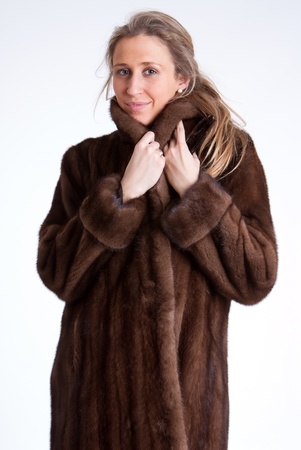 Young woman wearing a mink coatの写真素材