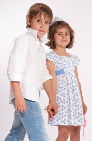 A young boy and a little girl holding handsの写真素材