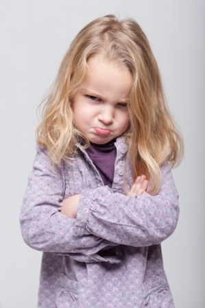 
Little girl with her arms crossed and angry expression
の写真素材