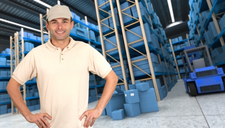 Deliveryman carrying a parcel in a distribution warehouseの写真素材