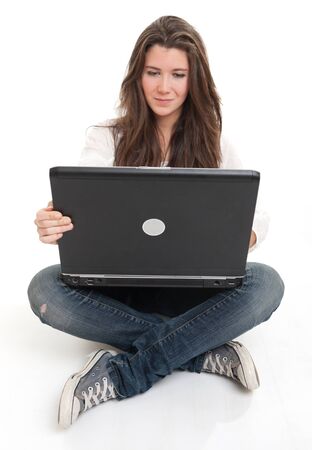 
Attractive young brunette using a laptop on the floor
の写真素材