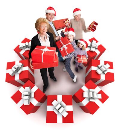 Happy family with Santas hats surrounded by giftsの写真素材