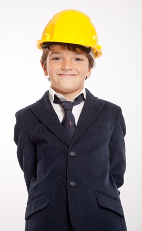 
Young boy in school uniform wearing a yellow safety helmet
の写真素材
