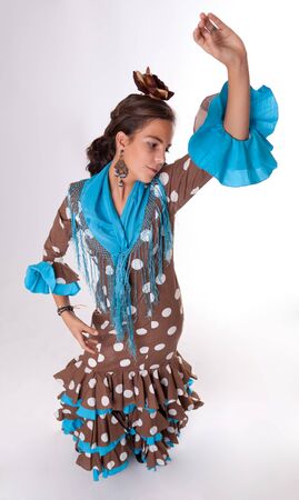 Aerial view of a dancing girl in a typical folkloric dress from Seville, Spainの写真素材