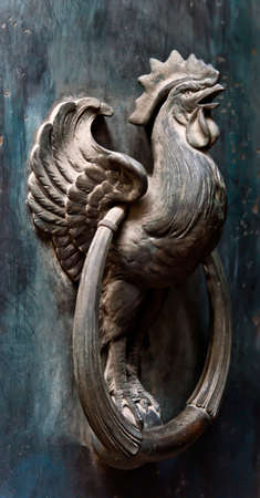 Door knocker in the shape of a cockの写真素材