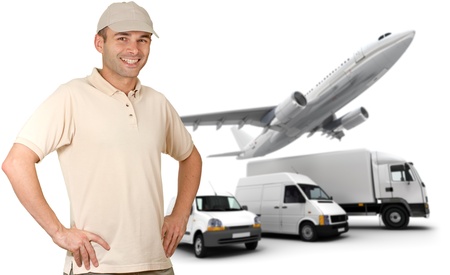 Smiling messenger against a transportation fleetの写真素材