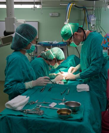 Medical team performing surgery on a young patientのeditorial素材