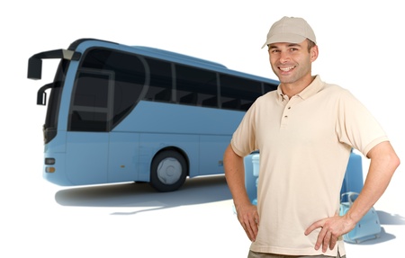 Smiling man with baseball cap by a pile of luggage and a coach busの写真素材