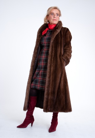 Senior lady wearing a mink coatの写真素材