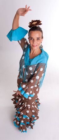 Woman wearing a typical folklore dress from Seville, Spainの写真素材