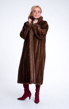 Senior lady wearing a mink coatの写真素材