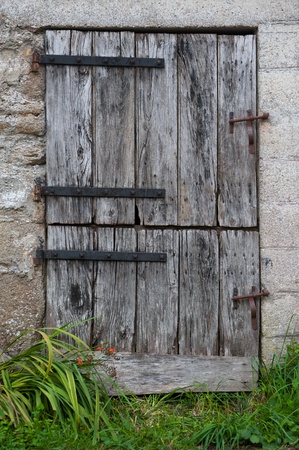 Old farm door with double openingの写真素材
