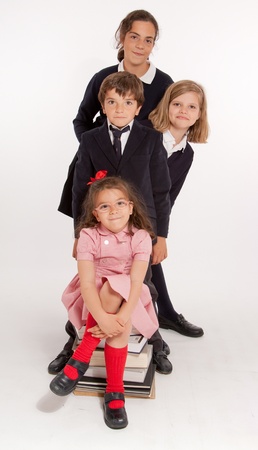 
A group of four children of different ages with school uniforms
の写真素材