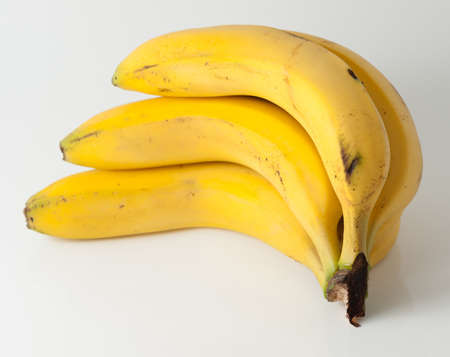 Bunch of bananas on a white backgroundの写真素材