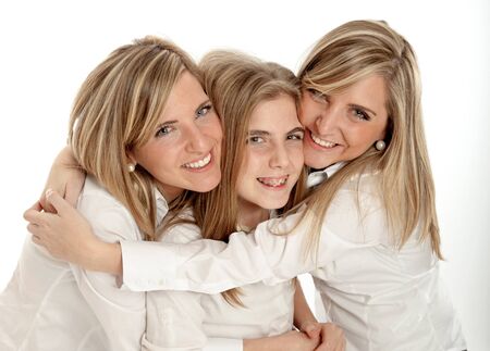
3 blond sisters of different ages in a hug smiling to the camera
の写真素材
