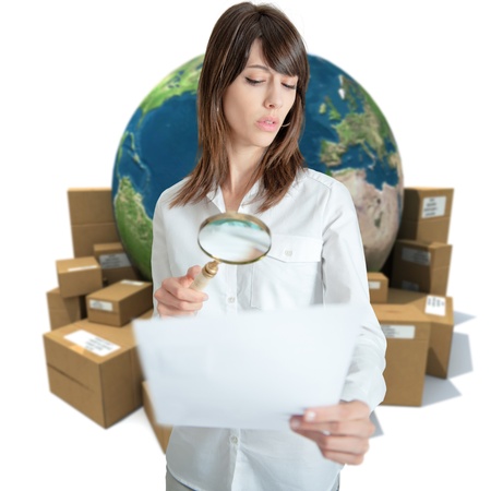 Young woman in a transportation background analyzing a document の写真素材