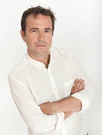 Portrait of a man with arms crossed and an attentive listener expressionの写真素材