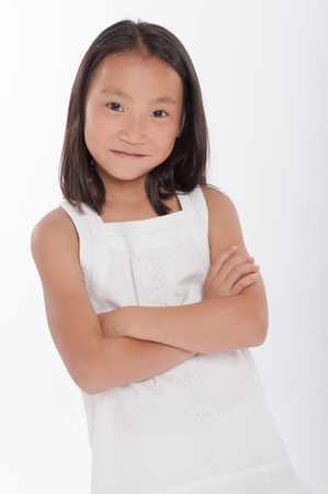 Portrait of a cute little girl of Asian backgroundの写真素材