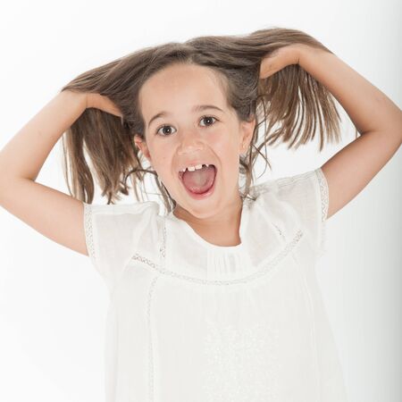 Little girl happily yellingの写真素材