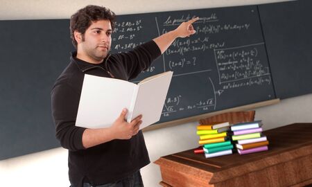 
Young man pointing to the blackboard in a maths classroom
の写真素材