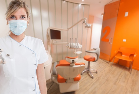 Young female dentist holding a syringeの写真素材