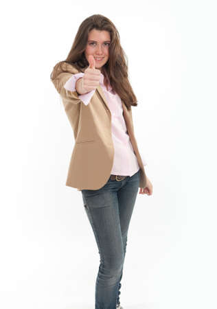
Very young woman in jeans and vest with her thumb up
の写真素材