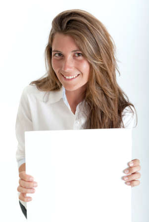 Young woman holding a blank square, perfect for inserting your own messageの写真素材