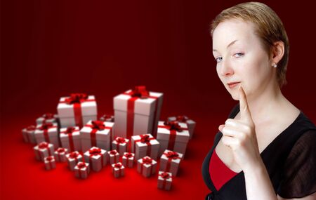 
Strict blonde with a warning gesture with a background of gift boxes
の写真素材