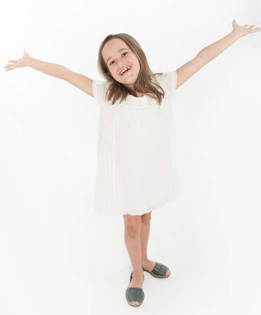 Little girl with a happy welcoming gestureの写真素材