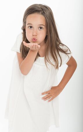 Little girl sending a kiss with her hand の写真素材