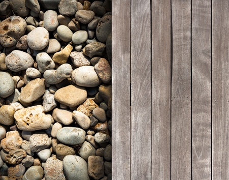 Contrasting texture of wooden deck and pebblesの写真素材