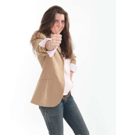 
Very young woman in jeans and vest with her thumb up
の写真素材
