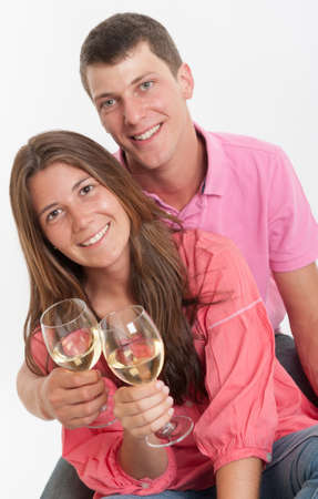 Young couple drinking white wineの写真素材