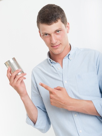 Young man showing an aluminum canの写真素材