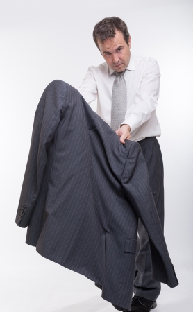 Businessman bullfighting using his vestの写真素材