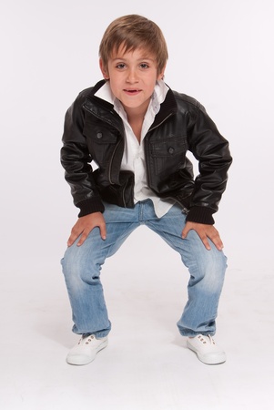 Smiling boy in a crouching positionの写真素材