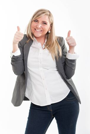 
Smiling young blond woman with her thumbs up
の写真素材